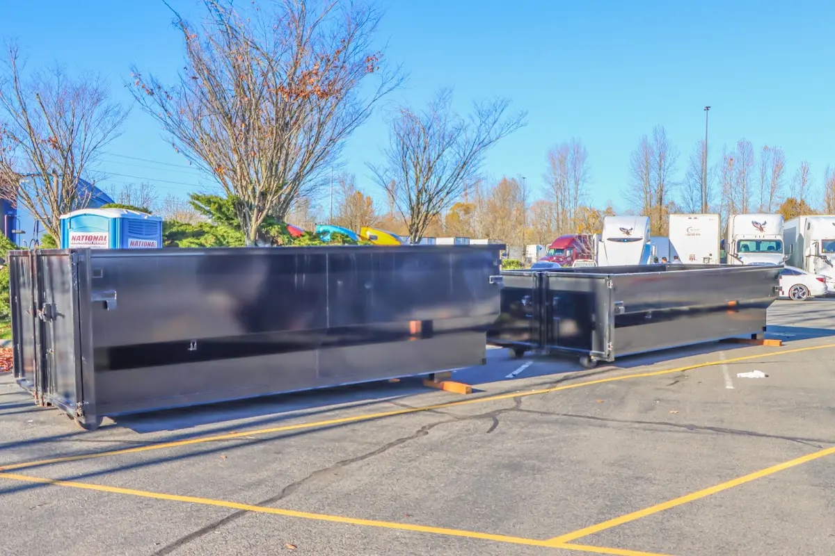 Professional dumpster rental service with roll-off container on residential driveway in Wausau